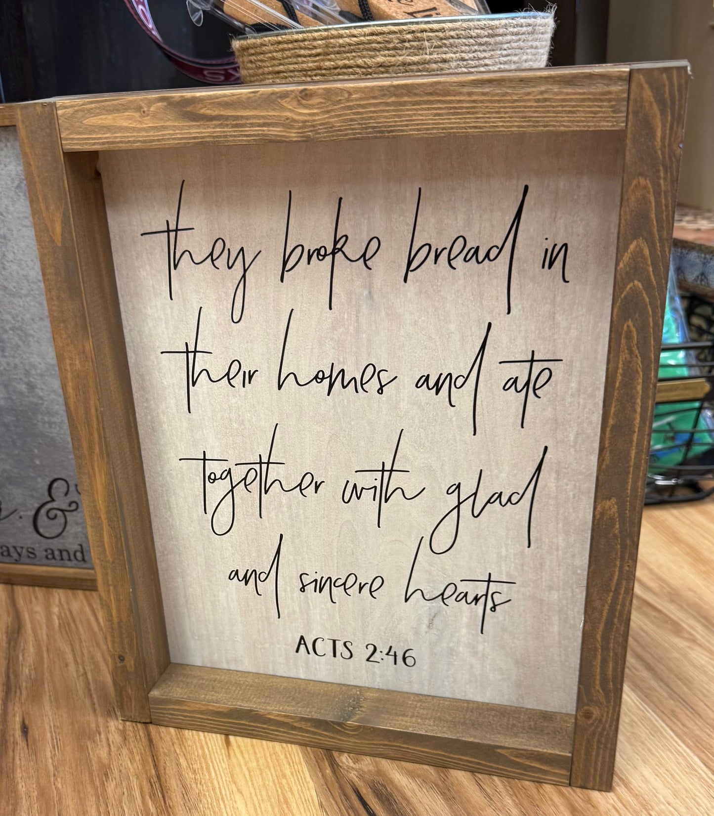 Wooden sign they broke bread