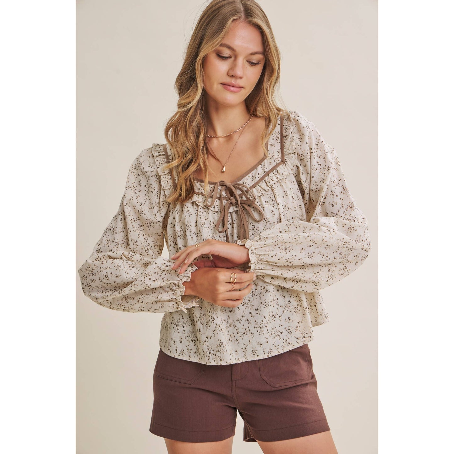in february - PRAIRIE ROMANCE BOTANICAL BOW TIE FRONT RUFFLED BLOUSE