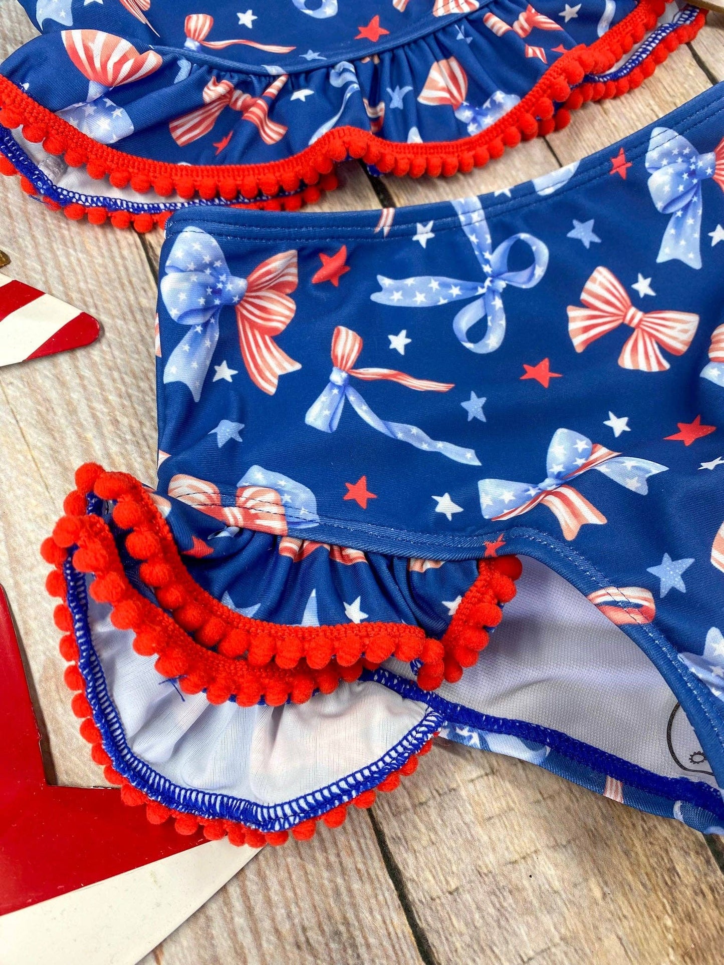 The Hair Bow Company - Navy Patriotic Bow Print Two-Piece Swimsuit | Baby Girls Ruffle Swim Set
