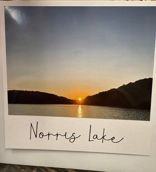 Norris Lake sunset peeking through mountains