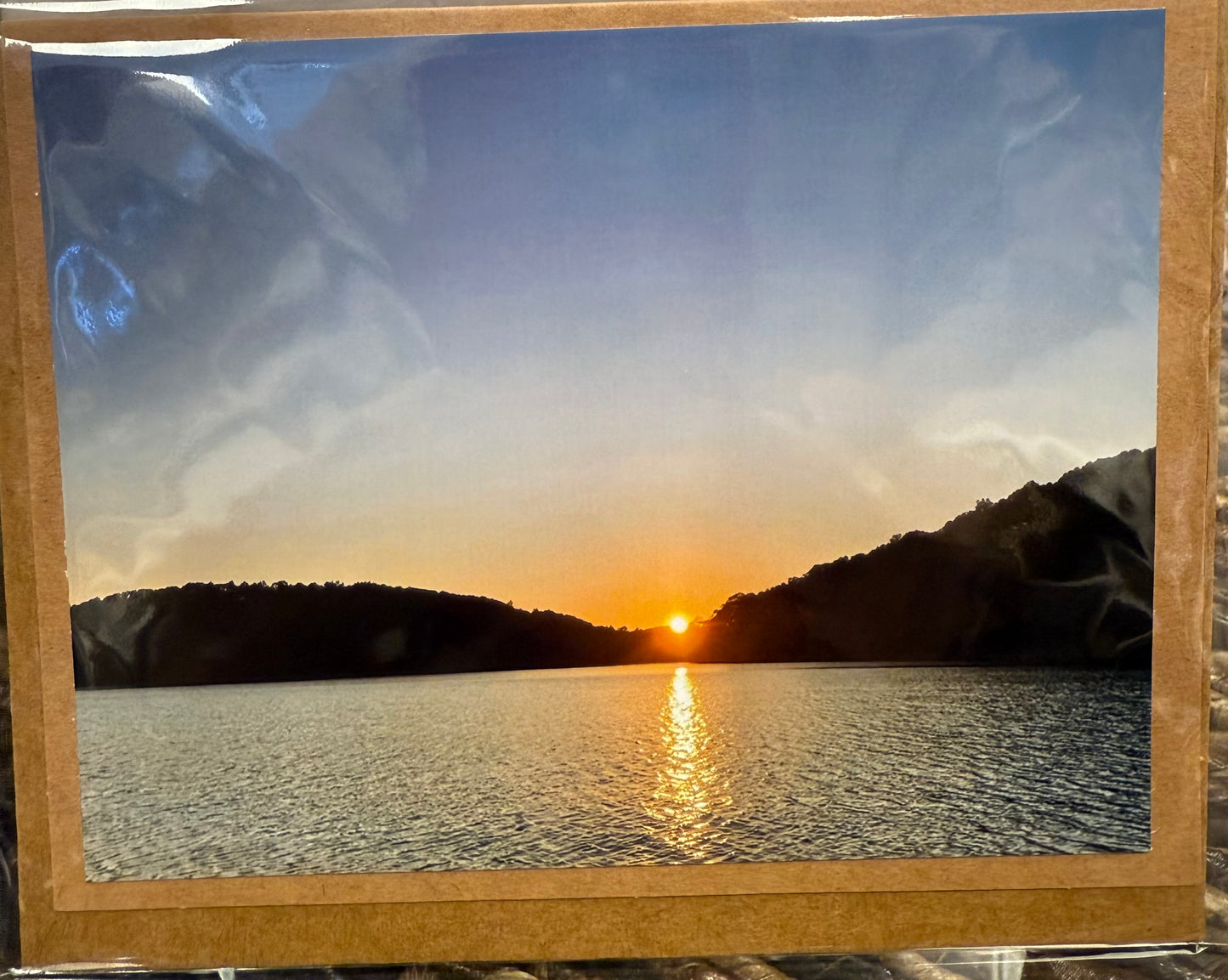 Norris Lake sun peeking through mountains brown photo card